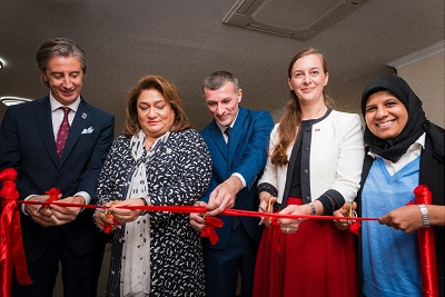 Cutting the ribbon to open the Qusar Women’s Resource Centre, (from left to right) Mr. Alessandro Fracassetti, Prof. Hijran Huseynova, Mr. Elman Mustafayev, Dr. Simone Haeberli, Ms. Mehjabeen Alarakhia